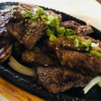 Kalbi B.B.Q · Perfectly marinated korean style short rib, cross cut & grilled