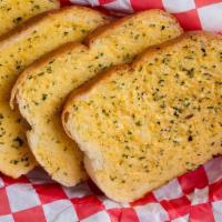 Garlic Bread · Our signature garlic spread on Texas cut toast. Comes in either 2 or 4 slices.