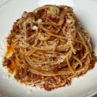 Spaghetti Bolognese · traditional meat and tomato ragu, spaghetti, grana padano