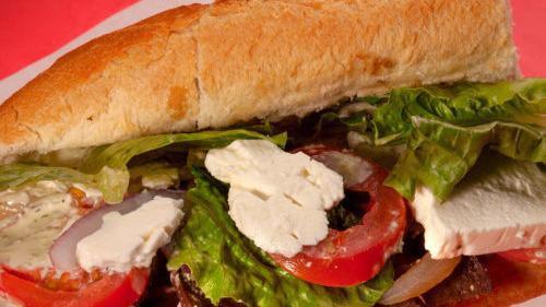 Gyro Steak Sandwich · Delicious gyro meat grilled with onions, topped with feta cheese, tomato, lettuce and our own fabulous dill sauce.