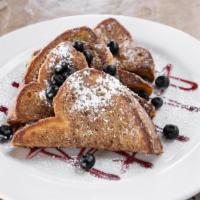 Texas Size French Toast · Four slices of french toast served with seasonal berries, butter and warm maple syrup.