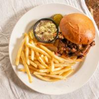 Texas Beef Brisket · Hickory smoked and sliced, piled high on a bun.
