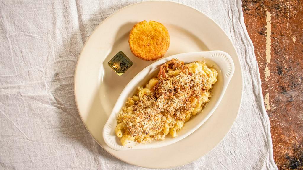 Ma'S Macaroni & Cheese · A mixture of three different cheeses, green chilis and bacon, combined with cavatappi pasta, to create a rich and creamy comfort delight. Dusted with buttery panko crumb topping. Served with cornbread.