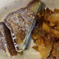 Monte Cristo Sandwich · French toast, with ham, swiss cheese, raspberry jam and maple syrup, with hash browns or bre...