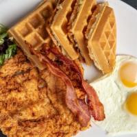 Buttermilk Fried Chicken & Waffles · With scrambled eggs, butter and maple syrup.