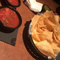 Chips And Salsa · Fresh tortilla chips served with a cup of house salsa.