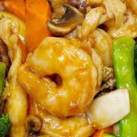 Triple  Delight · Shrimp, chicken, beef and votable stir fried in brown garlic sauce.