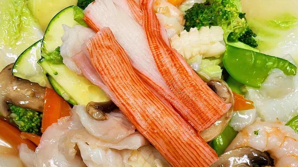 Seafood  Combo · Jumbo shrimps, scallops, crab sticks, squid, fish fillets and vegetables stir fried in white garlic sauce.