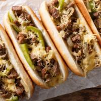 The Green Chili Philly Cheesesteak · Spicy and yummy cheesesteak sandwich with steak, grilled onions, green chili, jalapeños, and...