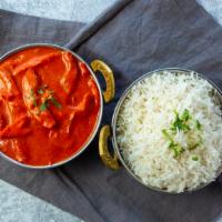 Butter Chicken · Tender cubes of grilled chicken cooked with cream, herbs, ginger, garlic, tomatoes, butter a...