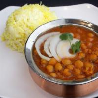 Channa Masala · Gently cooked chickpeas sautéed in a curry with blend of herbsand spices.