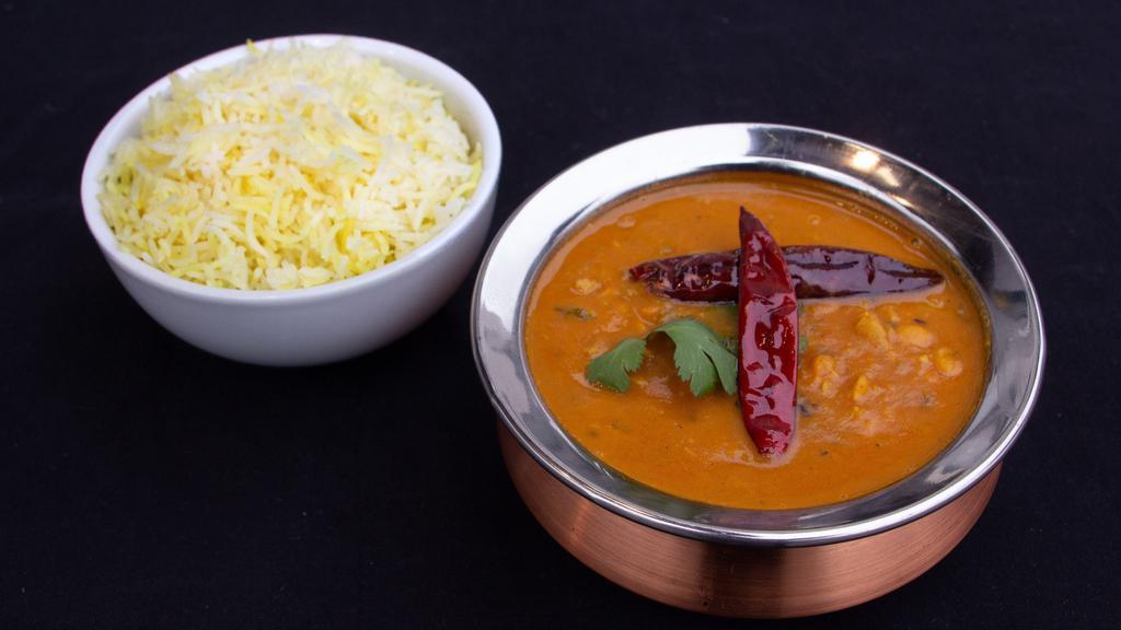 Yellow Daal · Yellow lentils cooked with onions, tomatoes and spices.