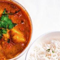 Chicken Curry · Chicken cooked in onion and tomato sauce with a blend of spices.