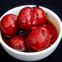Galub Jamun · Spongy milky balls soaked in rose scented syrup.