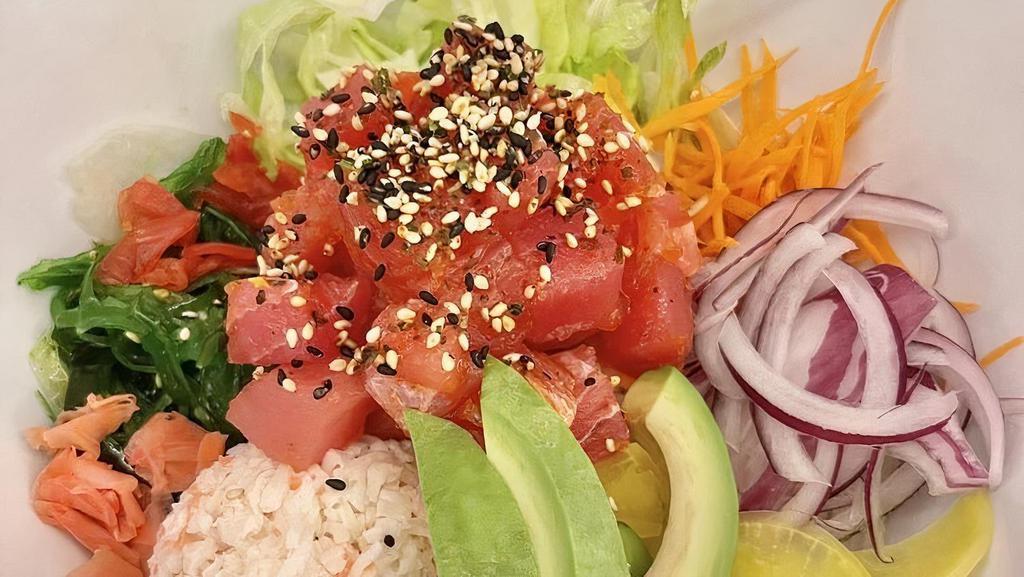 Tuna Poke · Tuna, sushi rice, crab salad, avocado, cucumber, edamame, lettuce, red onion, seaweed salad, ginger, red radish, yellow radish, dried seaweed with sesame seeds.