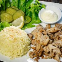 Chicken Shawarma · Gluten-free. Sautéed chicken breast strips served with salad, garlic paste, pickles and basm...