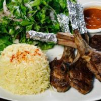 Grilled Lamb Chops · Gluten-free. Grilled lamb ribs served with salad, homemade tomato sauce and basmati rice.