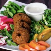 Falafel · Gluten-free,Vegan. Mix of crushed garbanzo beans, fava beans, garlic and onion mixed with de...