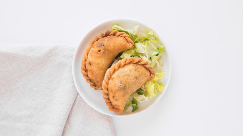 Samboosik · Deep fried dough filled with ground beef and pine nuts.