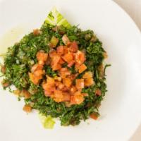Tabbouli · Vegan. Finely chopped fresh Italian parsley, tomatoes, mint, onion, bulgur, fresh lemon juic...