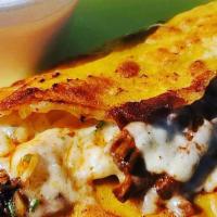Quesatacos (1) · Grilled corn tortilla with mozzarella cheese melted to perfection and topped with our signat...