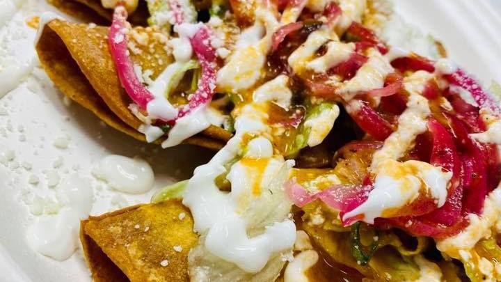 Tacos Dorados (2) · Our take on the traditional fried taquitos. Deep fried to perfection, topped with lettuce, pickled onion and habanero, sour cream, Mexican cheese, and our special sauce!