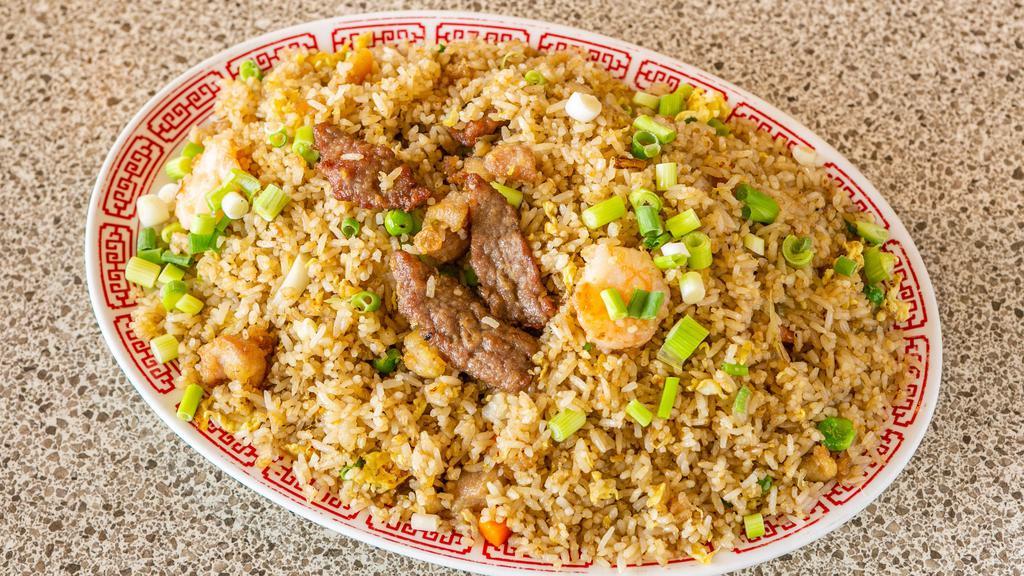 Ten Ingredient Fried Rice · With Shrimp, Beef, Chicken, and Vegetables.