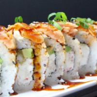 Flamed Salmon Roll · Inside: cucumber, avocado, cream cheese and crab mix. Outside: thin slices of salmon with a ...
