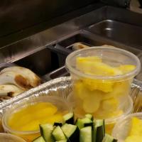 32 Oz Seasonal Fruit Platter · PIneapple, mango, watermelon.