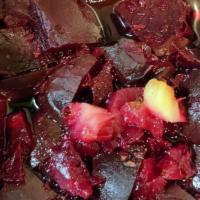 Beet Salad · Pickled beets (vinegar and pineapple juice), garlic and ginger.   Topped with parmesan chees...