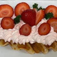 Strawberry Croffle · croissant dough baked in waffle pan topped with whipped cream and fresh strawberry.