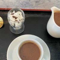 French Hot Chocolate · Valrhona dark chocolate simmered in milk.  Topped with whipped cream and chocolate sprinkled.