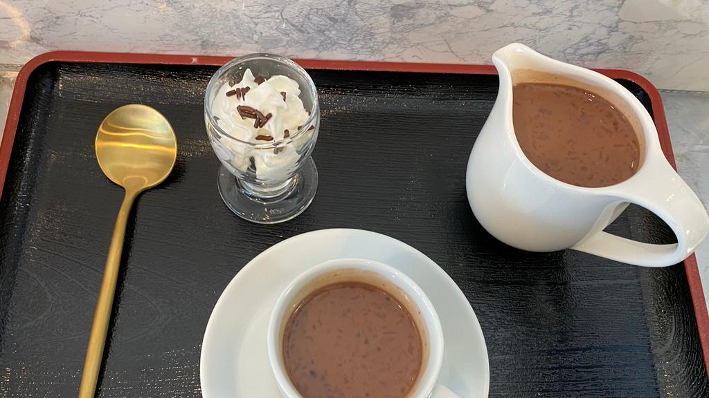 French Hot Chocolate · Valrhona dark chocolate simmered in milk.  Topped with whipped cream and chocolate sprinkled.