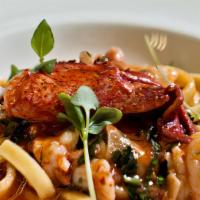 Lobster Fra Diavolo · *SPICY* Fresh Ribbons of House-Made Pasta, San Marzano Tomato, Basil & Calabrian Chile.