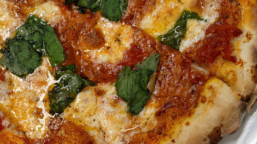 Margherita Pizza · San Marzano Tomato, Whole Basil Leaves & Fresh Mozzarella.