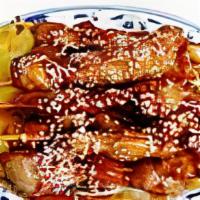Teriyaki Chicken
 · 8 pieces. Chicken on skewer served with special teriyaki sauce.