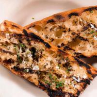 Garlic Bread · house baguette, roasted garlic butter.