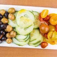 Mixed Veggie Plate · Turkish olives, cherry tomatoes, cucumber, and olive oil.