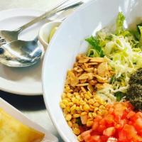 Green Tea Leaf Salad (Vegan). · Organic Fermented young tea leaves, fresh tomatoes, cabbage, roasted peanuts, sunflower, ses...