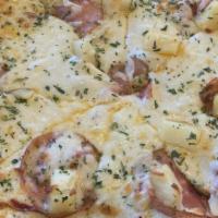 Ham & Pineapple Pizza · Our homemade tomato sauce topped with ham, pineapple, and our five cheese blend.