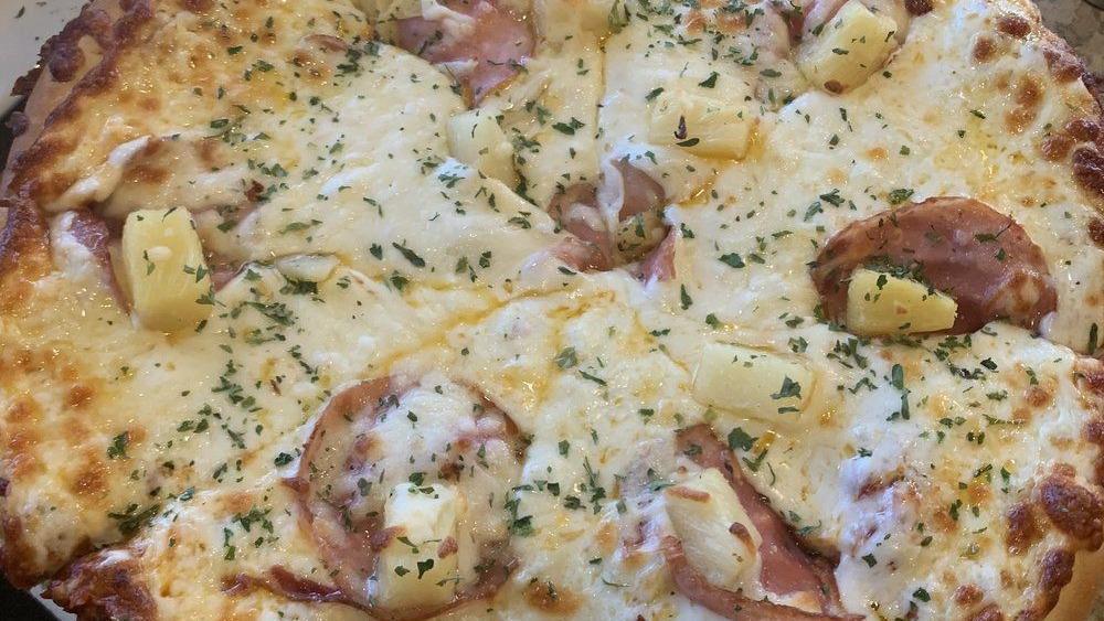 Ham & Pineapple Pizza · Our homemade tomato sauce topped with ham, pineapple, and our five cheese blend.