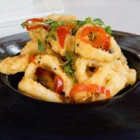 Calamari · Crispy, fried rings, creamy wasabi, sweet & spicy sauce, lemon vinaigrette