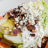 Classic Wedge Salad · Iceberg wedge, house-made blue cheese dressing, cherrywood
bacon, Gorgonzola crumbles, tomat...