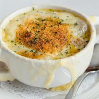 French Onion Soup · Caramelized five onion mix, rich broth, croutons, Gruyère cheese