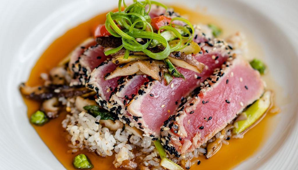 Wild Yellowfin Tuna Steak · Sesame seed crusted, seared rare, Asian rice, sautéed vegetables