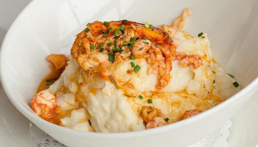 Lobster Mashed Potatoes · Garlic mashed potatoes, lobster meat, lobster butter, chives.
