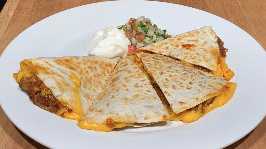 Quesadilla · Flour tortillas grilled with real cheddar cheese, sour cream and pico de gallo on the side
