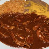 Mole Poblano · Chicken breast pieces in a housemade Puebla-style mole sauce.Served with rice,beans and tort...
