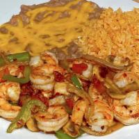 Camarones Tarasco · Prawns sauteed with garlic and vegetables.Served with rice ,beans and tortillas. Spicy.