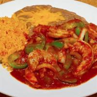 Spicy Prawns · Prawns sauteed with onions and peppers in a spicy red sauce.Served with rice,beans and torti...